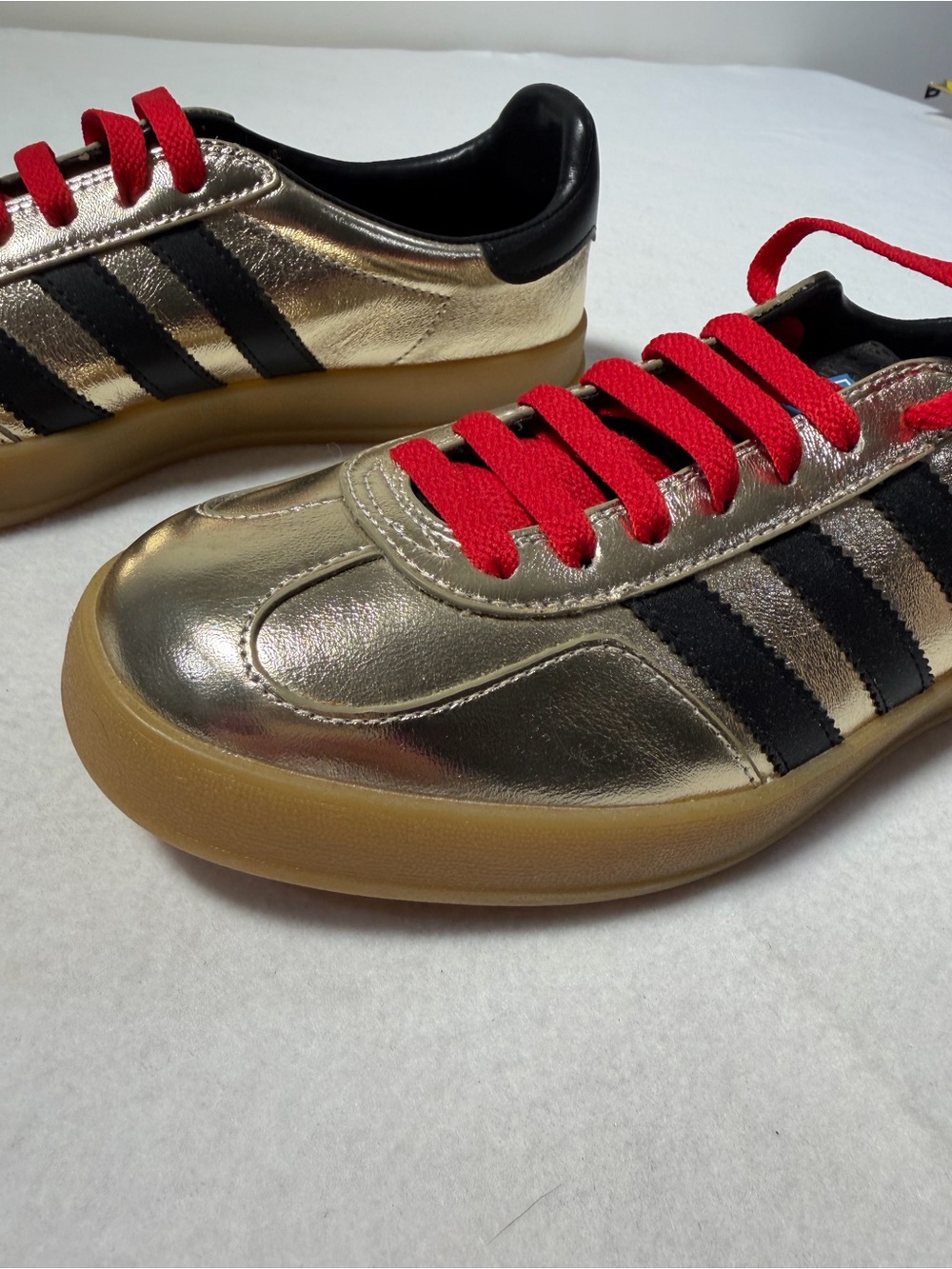 Gucci Metallic Gold Sneakers with Black Stripes and Red Laces - Picture 4 of 8